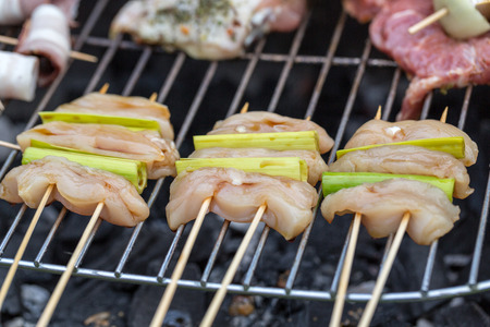 barbecue with delicious grilled meat and leek の写真素材