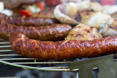 barbecue with delicious grilled meat and vegetables on grill の写真素材
