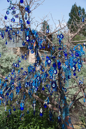 Evil eye in tree behind Uchisar Castle in Cappadocia,の写真素材