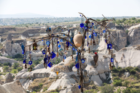 Evil eye in tree behind Love valley in Goreme national park. Cappadocia, Turkeyの写真素材