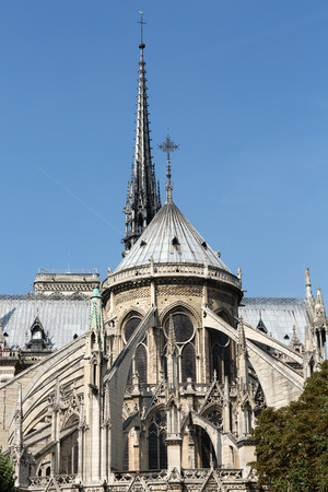 The spire and east side of Cathedral Notre Dame de Parisの写真素材