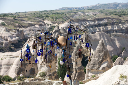 Evil eye in tree behind Love valley in Goreme national park. Cappadocia, Turkeyの写真素材
