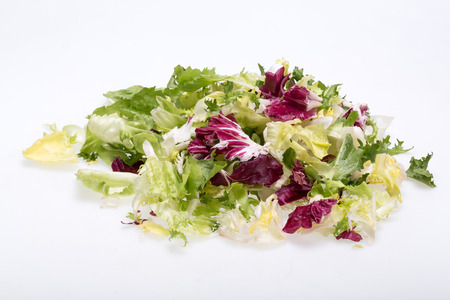 Green and red leaf of lettuce . Isolated on a white backgroundの写真素材