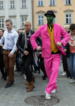 CRACOW, POLAND - MARCH 28, 2015:  the international Flashmob day of rueda de Casino,57 countries , 160 cities. Several hundred persons dance Hispanic rhythms on the Main Square in Cracowのeditorial素材