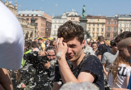 KRAKOW, POLAND - APRIL 11, 2015:  International pillow fight on April 11, 2015 in Old Market Square in Cracow. Polandのeditorial素材