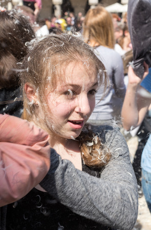 KRAKOW, POLAND - APRIL 11, 2015:  International pillow fight on April 11, 2015 in Old Market Square in Cracow. Polandのeditorial素材