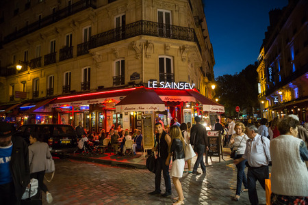 Latin Quarter of Paris, France. Narrow street of Paris among old traditional parisian houses and cafe in Paris.のeditorial素材