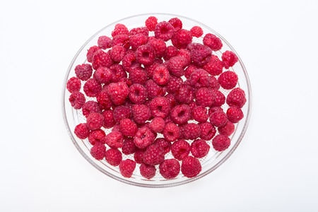 A beautiful selection of freshly picked ripe red raspberries.