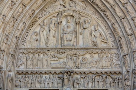 Paris - West facade of Notre Dame Cathedral. The Saint Anne portal and tympanumの写真素材