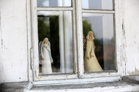 Angel statue in the old window