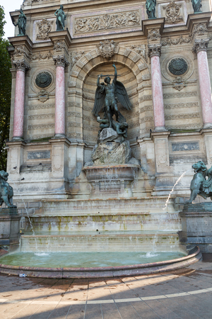 statues of Fountain Saint Michel in Parisの写真素材