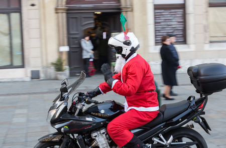 CRACOW, POLAND - DECEMBER 6, 2015: the parade of Santa Clauses on motorcycles around the Main Market Square in Cracow. Polandのeditorial素材