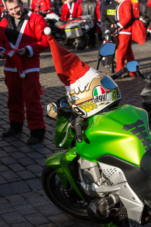 CRACOW, POLAND - DECEMBER 6, 2015: the parade of Santa Clauses on motorcycles around the Main Market Square in Cracow. Polandのeditorial素材