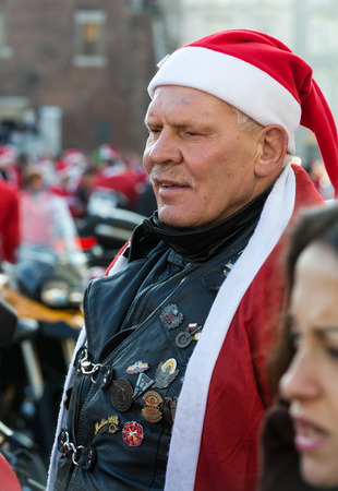 CRACOW, POLAND - DECEMBER 6, 2015: the parade of Santa Clauses on motorcycles around the Main Market Square in Cracow. Polandのeditorial素材