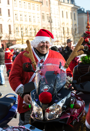 CRACOW, POLAND - DECEMBER 6, 2015: the parade of Santa Clauses on motorcycles around the Main Market Square in Cracow. Polandのeditorial素材
