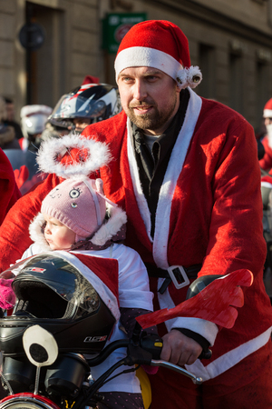 CRACOW, POLAND - DECEMBER 6, 2015: the parade of Santa Clauses on motorcycles around the Main Market Square in Cracow. Polandのeditorial素材