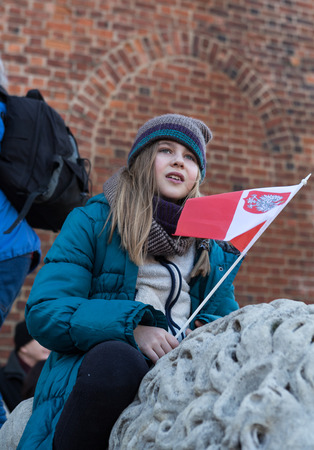 CRACOW, POLAND - DECEMBER 19, 2015: Cracow, Main Square -  The demonstration of the Committee of the Defence Protection of the Democracy against the break of law through the government PIS in Poland.のeditorial素材