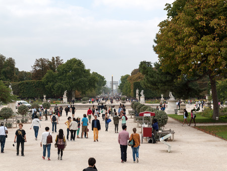 Paris -  Local and Tourist in famous Tuileries garden. Tuileries Garden (Jardin des Tuileries) is a public garden located between the Louvre Museum and the Place de la Concorde. France.のeditorial素材