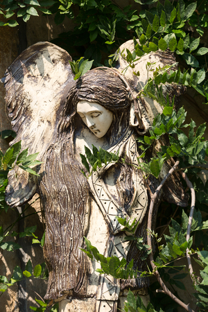 Carved wooden statue of angelの写真素材