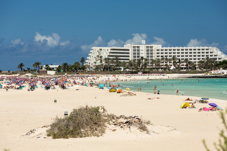Tourists rest on Corralejo Beach on Fuerteventura, Canary Islandsのeditorial素材