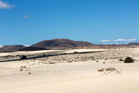 Corralejo sand dunes and extinct volcanoes  in the background. Fuerteventura, Canary Islands, Spainの写真素材