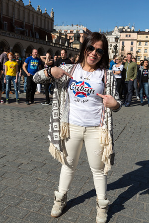 CRACOW, POLAND - APRIL 2, 2016: International Flashmob Day of Rueda de Casino, 57 countries, 160 cities. Several hundred persons dance Hispanic rhythms on the Main Square in Cracow. Polandのeditorial素材