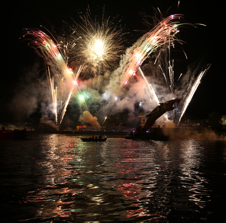 KRAKOW, POLAND - JUNE 4, 2016:  Yearly Great Dragons Parade connected with the fireworks display, taking place on the river Vistula at Wawel. Cracow , Polandのeditorial素材