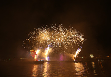 KRAKOW, POLAND - JUNE 4, 2016:  Yearly Great Dragons Parade connected with the fireworks display, taking place on the river Vistula at Wawel. Cracow , Polandのeditorial素材