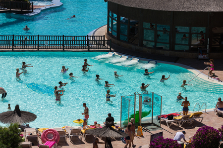Active group of people a workout at the swimming pool on Fuertevetura. Spainのeditorial素材
