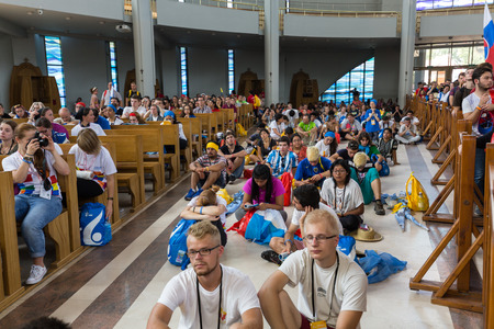 CRACOW, POLAND - JULY 26, 2016: World Youth Day 2016 - Crowd of Pilgrims inside of  the Sanctuary of Divine Mercy in Lagiewniki. Cracow, Polandのeditorial素材