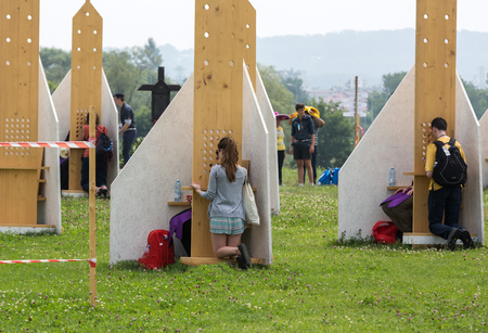 CRACOW, POLAND -  JULY 26, 2016: Pilgrims in Zone of Reconciliation at Sanctuary of Divine Mercy in Lagiewniki. WYD participants will be able to confess to more than 50 confessionals. Cracow Polandのeditorial素材