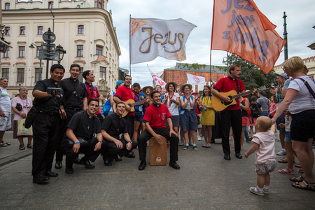 CRACOW, POLAND - JULY 24, 2016: Pilgrims of World Youth Day sing and dance on the Main Square in  Cracow. Polandのeditorial素材
