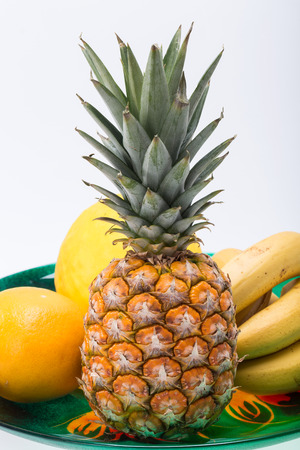 Assortment of fresh exotic fruits isolated on whiteの写真素材