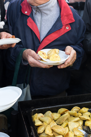 CRACOW, POLAND - DECEMBER 20, 2015:  Christmas Eve for poor and homeless on the Central Market in Cracow. Every year the group Kosciuszko prepares the greatest eve in the open air in Polandのeditorial素材