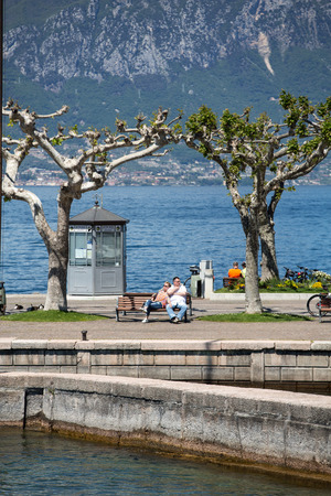 Garda lake with promenade in Torri del Benaco, Italyのeditorial素材