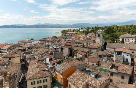 View of colorful old buildings in Sirmione and Lake Garda from Scaliger castle wall, Italyのeditorial素材