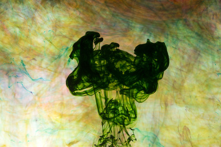 Acrylic colors and ink in water. Abstract background.