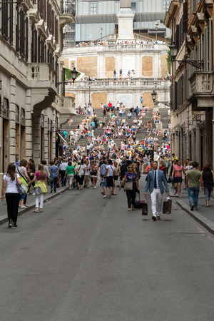 ROME, ITALY - JUNE 15, 2015: Spanish Steps and Via Condotti in Rome. This street is the center of fashion shopping in Rome with the atelier of Bulgari, Armani, Cartier, Fendi, Gucci, Prada and others.のeditorial素材