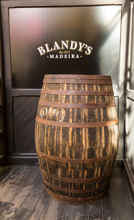 The museum - storage of expensive vintage wine Madera. Huge barrels are marked by data of wineのeditorial素材