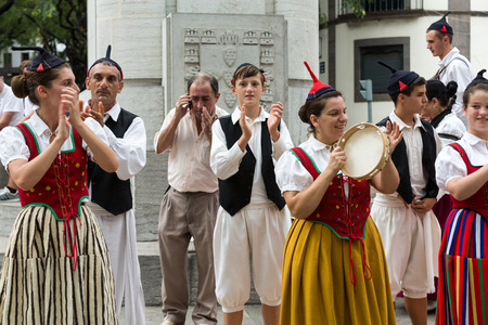FUNCHAL, PORTUGAL - SEPTEMBER 2, 2015: Dancers with local costumes demonstrating a folk dance during the Wine Festival in Funchal on the Madeira, Portugal.のeditorial素材