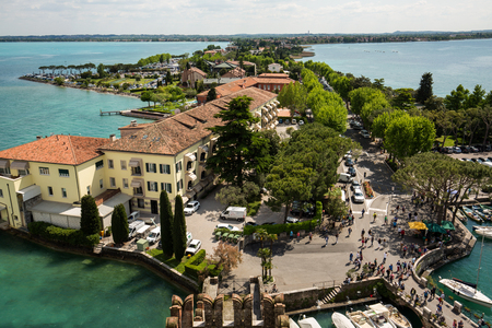 View of colorful old buildings in Sirmione and Lake Garda from Scaliger castle wall, Italyのeditorial素材