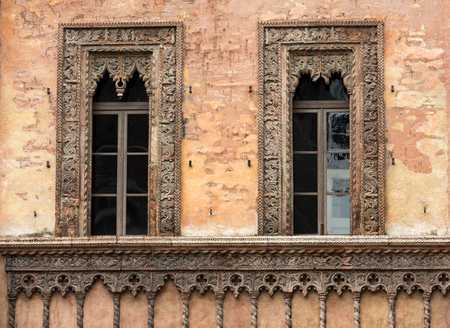 Old window in palace on Piazza Soro The historic city center of Mantova Lombardy .Italyの写真素材