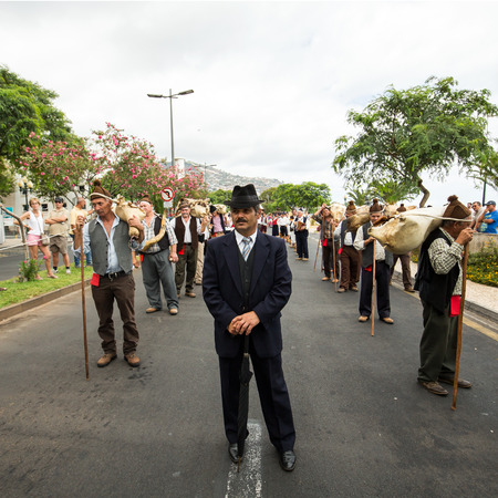 FUNCHAL, PORTUGAL - SEPTEMBER 4, 2016: Group of people in traditional costume  durnig historical and...