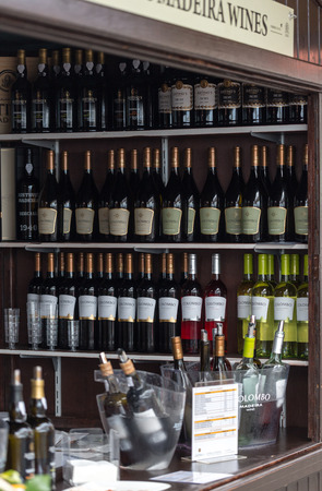 FUNCHAL, MADEIRA, PORUGAL - SEPTEMBER 3, 2016:  Wine producers encourage to the tasting of their wines during Madeira wine Festival in Funchal on Madeira, Portugal,のeditorial素材