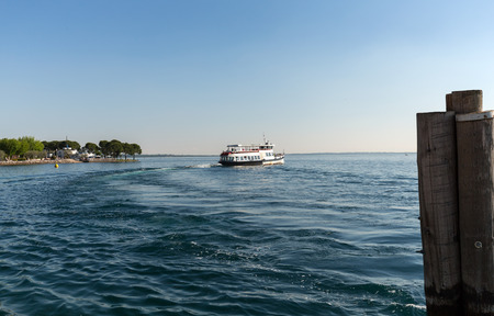 Ferry boat on  Lake Garda. Garda Lake is one of the most frequented tourist regions of Italy.のeditorial素材