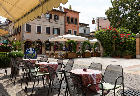 LAZISE, ITALY - MAY 6, 2016: Shops, bars and restaurants  in Lazise at Garda Lake. Italyのeditorial素材