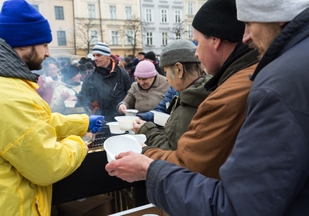 CRACOW, POLAND - DECEMBER 18, 2016:  Christmas Eve for poor and homeless on the Central Market in Cracow. Every year the group Kosciuszko prepares the greatest eve in the open air in Polandのeditorial素材