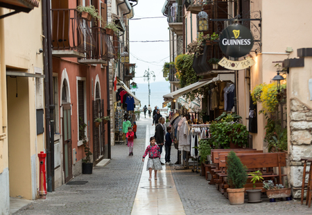 LAZISE, ITALY - APRIL 30, 2016: Shops, bars and restaurants  in Lazise at Garda Lake. Italyのeditorial素材