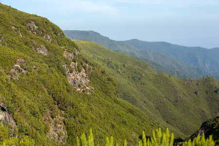 Picturesque aerial panorama of mountains and rainforest hills on Madeira island, Portugal.の写真素材