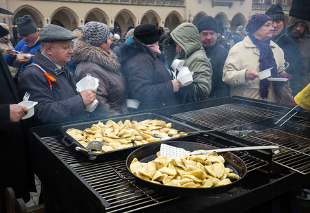 CRACOW, POLAND - DECEMBER 18, 2016:  Christmas Eve for poor and homeless on the Central Market in Cracow. Every year the group Kosciuszko prepares the greatest eve in the open air in Polandのeditorial素材